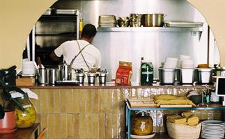 Manzé in North Melbourne, Victoria. Photo of restaurant with view into the kitchen