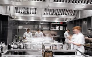 Four chefs working in the kitchen at Restaurant Gordon Ramsay in London, UK